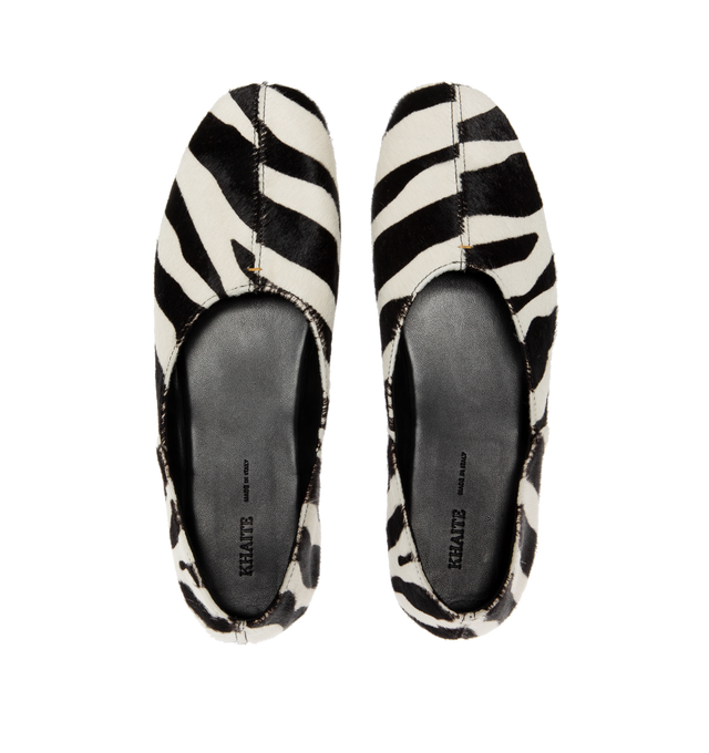 Image 4 of 4 - BLACK - KHAITE Jane Flat in Zebra Haircalf featuring a slipper-like flat, a flexible, cushioned insole for cloud-like comfort and signature gold staple detail at rounded vamp. Zebra print haircalf - 100% calfskin. Made in Italy. 