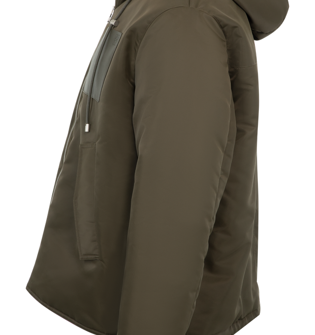 Image 3 of 3 - GREEN - Loewe Hooded jacket in compact nylon twill featuring a padded construction, a hooded collar with a leather drawstring and an adjustable drawstring hem. Regular fit and regular length with zip front fastening, buttoned flap pockets, inside welt pocket with LOEWE Anagram embroidery and Anagram embossed leather chest patch pocket. Fully lined. Main material: Polyamide. Made in Portugal. 