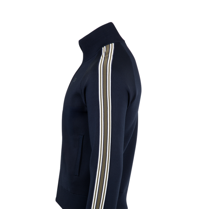 Image 3 of 3 - NAVY - Wales Bonner Tide Track Jacket featuring knit viscose-blend, rib-knit stand collar, hem, and cuffs, zip closure, logo embroidered at chest, welt pockets and stripes at raglan sleeves. 75% viscose, 23% polyester, 2% nylon. Made in China. 