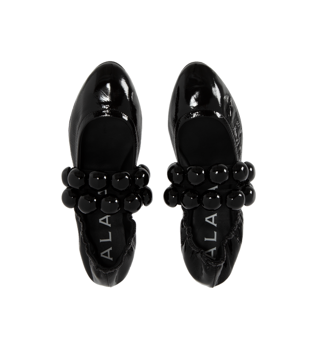 Image 4 of 4 - BLACK - Alaia Sphere Strap Ballet Flats feature leather-covered half spheres, double elastic straps, and rubber soles. 100% calf leather. Made in Italy.  