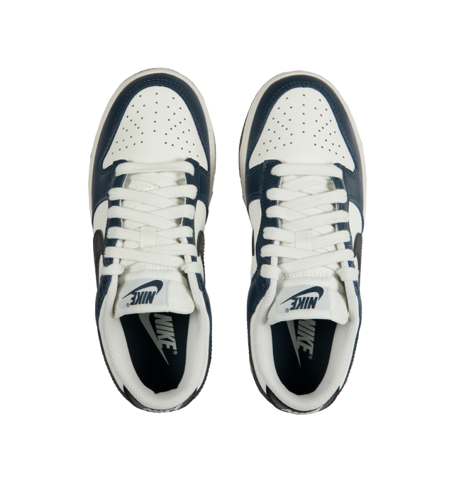 Image 5 of 5 - BLUE - Nike Dunk Low Sneakers with white and midnight navy color-blocking with a black swoosh,  a padded, low-cut collar, leather upper with a slight sheen and durability, foam midsole offering lightweight, responsive cushioning. Perforations on the toe add breathability. Rubber sole with classic hoops pivot circle provides durability and traction. 
