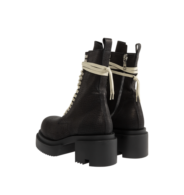Image 3 of 4 - BLACK - Rick Owens Men's lace-up Bogun boots crafted from washed calf leather. Mid-calf height, rounded toe style featuring a zipper on the leg for easy fastening, eyelets and hooks with long laces that wrap around the ankle and a back pull tab. Rubber mega creeper sole with toothed square 6cm high heel. 100% calf leather upper, lining and insole. Thermoplatic polyurethane sole.  Made in Italy. 