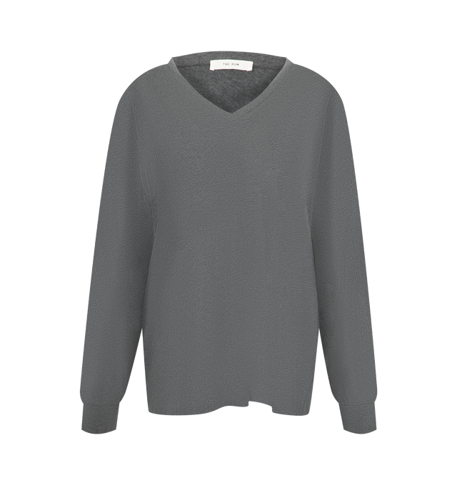 Image 1 of 2 - GREY - The Row Women's Birket Top is crafted from a cozy cashmere and features a classic V-neckline, long sleeves, and seamless construction for a clean, minimalist silhouette. This designer cashmere sweater combines exceptional Italian craftsmanship with a smooth, single-ply knit that offers lightweight warmth, natural stretch, and everyday comfort. Main Material: 100% Cashmere. Made in Italy. 