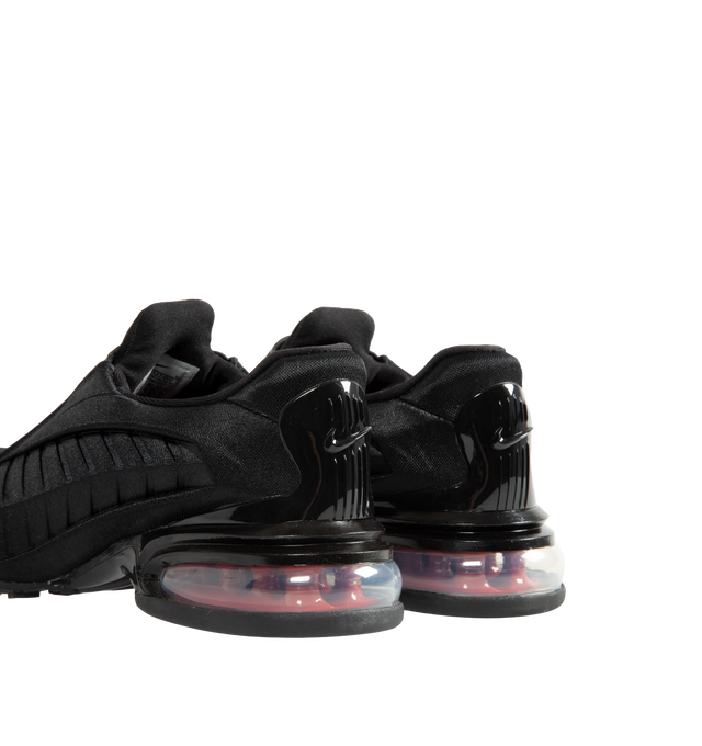 Image 3 of 5 - BLACK - Nike Women's Air Max Dolce Shoes revive an iconic silhouette that seamlessly transitions from casual everyday wear to elevated styling. Originally rooted in performance running, this distinctive design retains the signature details that made it a standout within the Air Max family, including a laceless molded upper, supportive overlay cage, and visible Max Air cushioning in the heel. Finished with a foam midsole for enhanced comfort, the Air Max Dolce delivers lightweight cushioning a 