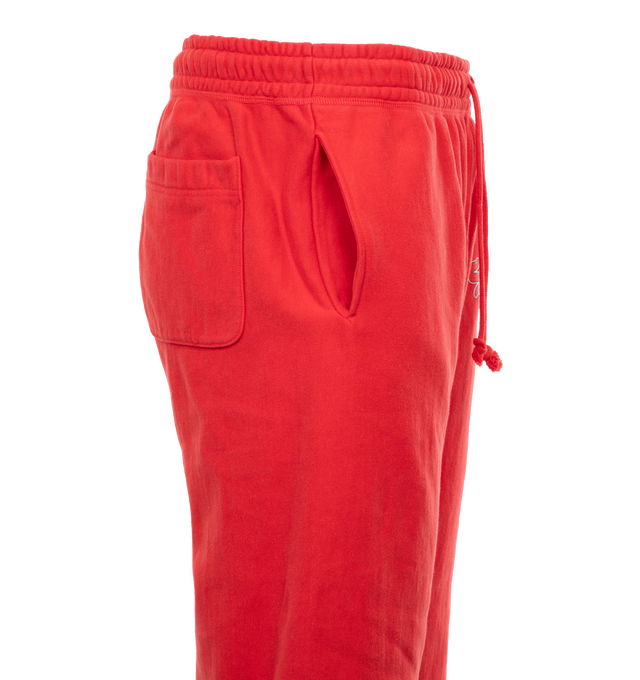 Image 3 of 5 - RED - SAINT MICHAEL Sweat Pants featuring elastic waist with drawstrings, side pockets and back pocket, logo on leg, no side seam and elastic hem. 100% cotton. 