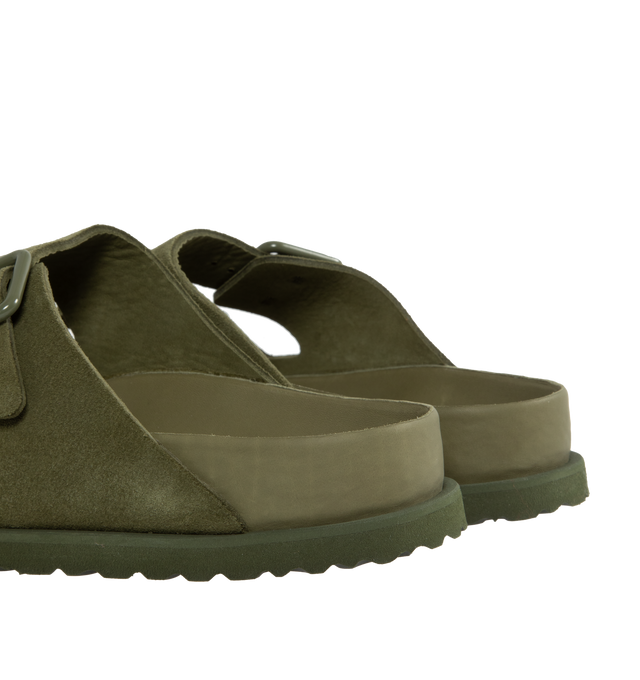 Image 3 of 4 - GREEN - Birkenstock's Arizona sandals in a regular width. The iconic Arizona sillhouette is  updated in suede featuring adjustable straps with buckle closures, logo details, shaped insole, and EVA outsole. Upper: Luxurious fine flesh out suede, a full grain leather that has been flipped to use the fuzzy side. Footbed: Anatomical shaped BIRKENSTOCK cork-latex footbed, covered with premium, color-matching smooth nappa leather. Sole: EVA outsole with a 3mm EVA welt updates the standard die-cut o 
