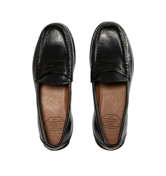 Image 4 of 4 - BLACK - Visvim Men's Fabro-Folk Leather Loafers are crafted from Italian vegetable-tanned horsehide and feature a minimalist penny loafer silhouette with hand-sewn construction and Goodyear-welted detailing. Designed with a pigment-free leather lining, natural cork insole, leather welt and midsole, and a Vibram outsole for lasting comfort, durability, and resoling capability. Main Material: Italian Vegetable-Tanned Horsehide. Lining: Pigment-Free Leather. Insole: Natural Cork. Midsole: Leathe 