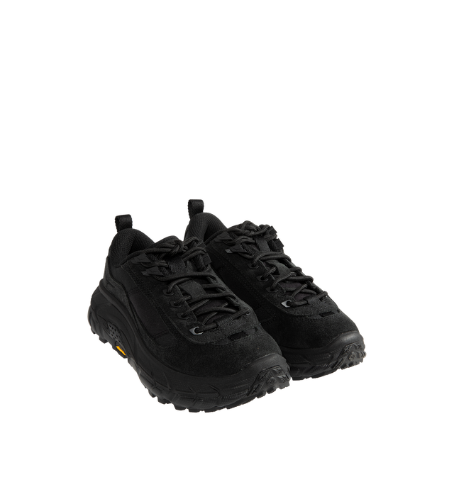 Image 2 of 5 - BLACK - Hoka Unisex Tor Summit FLD Sneakers are crafted from premium nubuck leather and feature a rugged outdoor-inspired silhouette. Designed with metal eyelets, a rubber mud guard, and a secondary lace system for enhanced functionality, they are finished with a Vibram Megagrip outsole for reliable traction. Main Material: Leather and Textile. Sole: Rubber. *Unisex style in men's sizing. 
