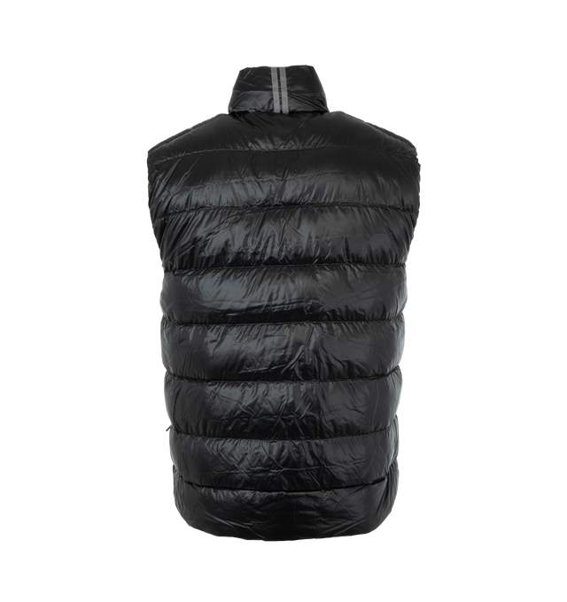 Image 2 of 3 - BLACK - CANADA GOOSE Crofton Down Vest featuring packable into interior left pocket, ultra lightweight channel fill construction paired with lightweight fabrics and trims, storm flap underneath 2-way zipper keeps the elements out, 2 exterior pockets: hand pockets with zipper closures and tricot fabric at knuckle side for softness and warmth and 1 exterior pocket: drop-in pocket. 100% recycled nylon. 