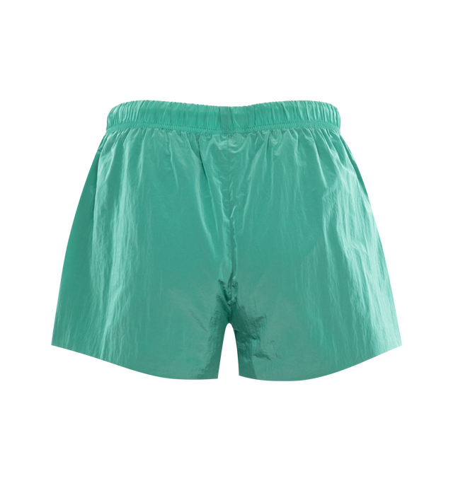 Image 2 of 3 - GREEN - FEAR OF GOD ESSENTIALS Crinkle Nylon Running Shorts featuring a relaxed fit, lightweight crinkle nylon construction, a rubber brand label on the front, side hand pockets, and an adjustable drawstring waistband. 100% nylon. 