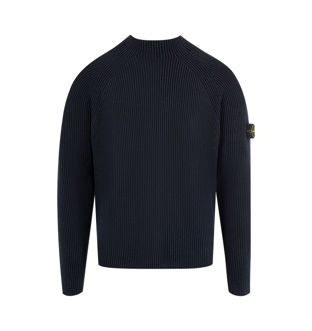 Image 1 of 3 - NAVY - STONE ISLAND Mock Neck Sweater featuring stitching along neckline, raglan sleeves, Stone Island badge on left sleeve, plain hem on cuffs and bottom and loose fit. 57% virgin wool, 35% cotton, 7% polyamide/nylon, 1% elastane/spandex. 