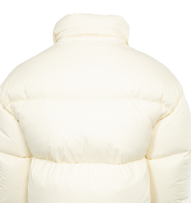 Image 5 of 5 - NEUTRAL - MONCLER GENIUS MONCLER X ROC NATION BY JAY-Z ANTILA JACKET is an oversized tonal logo patch details one sleeve of this channel-quilted puffer crafted in winter-white palette with gleaming goldtone hardware. This jacket runs small, order a size up. This jacket features a two-way front-zip closure, stand collar; removable drawstring hood, side-seam pockets and lined with down fill. 100% polyamide. 
