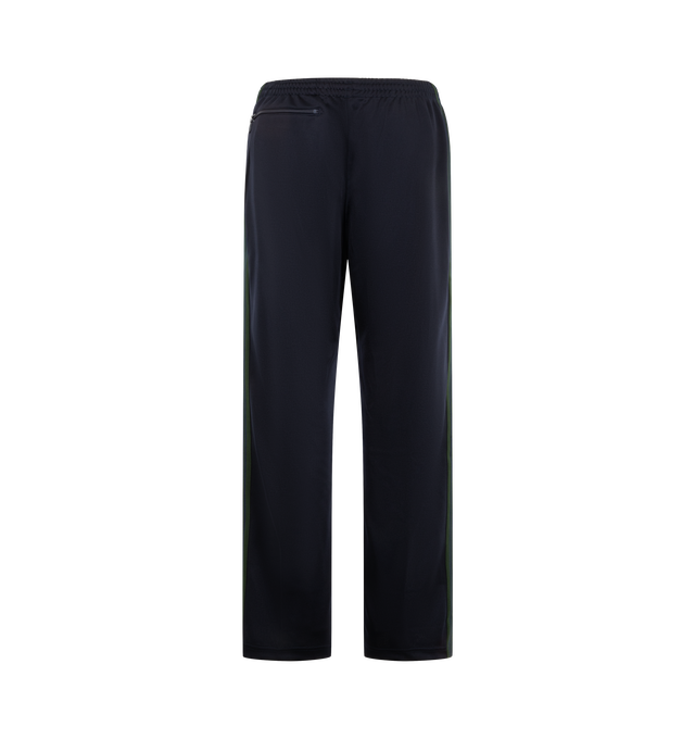 Image 2 of 3 - NAVY - Needles Men's Track Pant - Poly Smooth is crafted from smooth polyester jersey and features the brands signature track pant silhouette with side stripe detailing and embroidered branding. Designed for a relaxed fit, this athletic-inspired style combines comfort and versatility with a streamlined profile and elasticized waistband. Main Material: Polyester. Fit: Relaxed. Waist: Elasticized. Details: Side Stripes, Embroidered Logo. Made in Japan. 