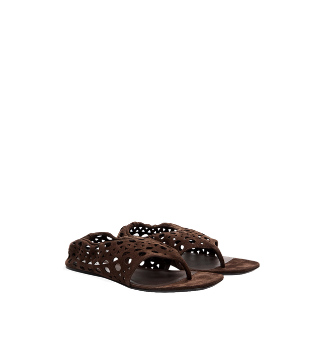 Image 1 of 1 - BROWN - Alaa Women's Neo Vienne Flat Sandals are crafted from soft velvet calfskin leather and feature a minimalist thong silhouette with the house's signature Vienne perforated detailing for subtle texture and refined elegance. Designed with a flat sole for effortless warm-weather wear. Main Material: Velvet Calfskin Leather. Made in Italy. 