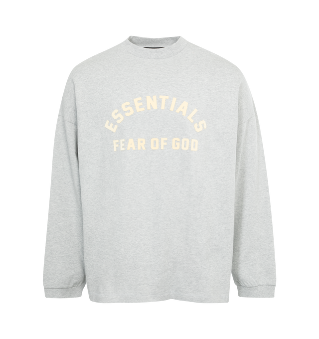 Image 1 of 2 - GREY - FEAR OF GOD ESSENTIALS Crewneck Long Sleeve T-Shirt featuring rib knit crewneck and cuffs, logo bonded at front, dropped shoulders and rubberized logo patch at back. 100% cotton. Made in Viet Nam. 