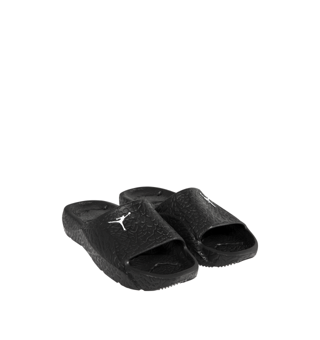 Image 2 of 4 - BLACK - JORDAN Franchise Shower Slides featuring a single piece of robust yet flexible foam, quick-drying, drainage holes throughout the outsole, a raised elephant print that helps add traction to the footbed, herringbone tread pattern on the foam outsole and Jumpman branding. 