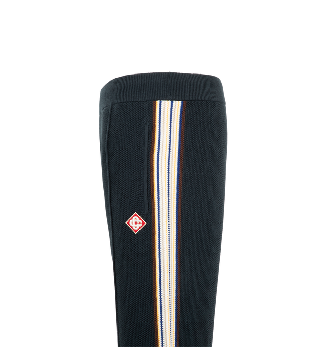 Image 3 of 3 - BLUE - Casablanca Men's Caf Stripe Track Trousers are crafted from a cotton-wool blend and feature a relaxed straight-leg silhouette. Designed with an elasticized waistband and drawstring fastening, these track trousers are detailed with side pockets, a back patch pocket, pin-tuck seams at the front. Main Material: 50% Cotton, 48% Wool, 1% Polyamide, 1% Elastane. Embroidery: 100% Viscose.  