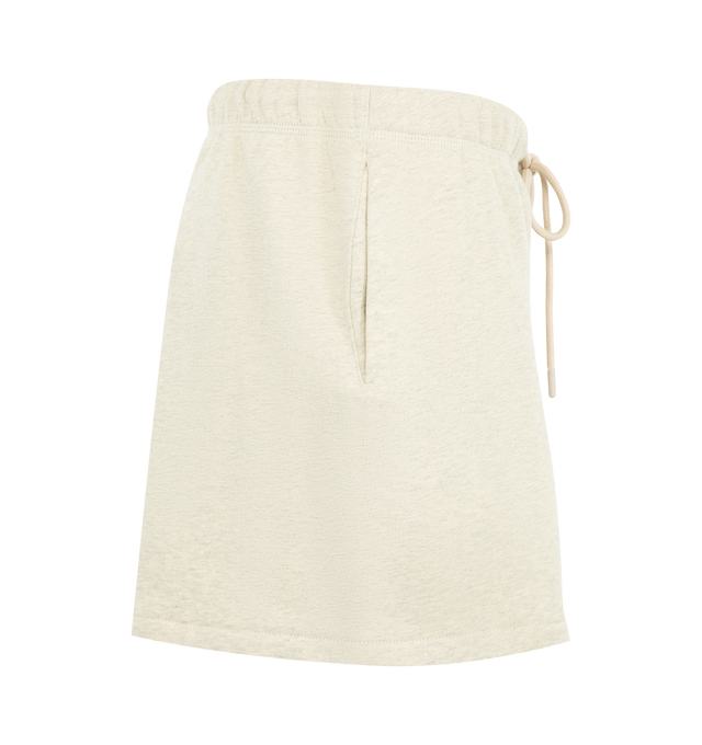 Image 3 of 3 - NEUTRAL - Fear of God Essentials Womens Classic Sweatshorts are crafted from heavyweight cotton fleece with a pigment-dyed finish. Feature a relaxed classic fit, elasticized waistband with adjustable drawcord and bungee, side-seam pockets, and signature Essentials label. Main Material: 100% Cotton. Imported. 