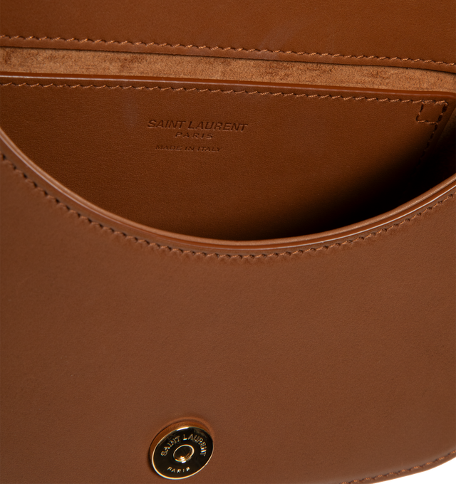 Image 3 of 3 - BROWN - SAINT LAURENT Voltaire Top Handle Bag in canvas featuring top-handle badecorated with the cassandre, an adjustable handle for hand or shoulder carry, suede lining, bronze-toned hardware, magnetic snap closure and one flat pocket. 6.9" x 8.3" x 3.1". Handle drop: 5.59.3". Calfskin, cotton, brass. Made in Italy. 