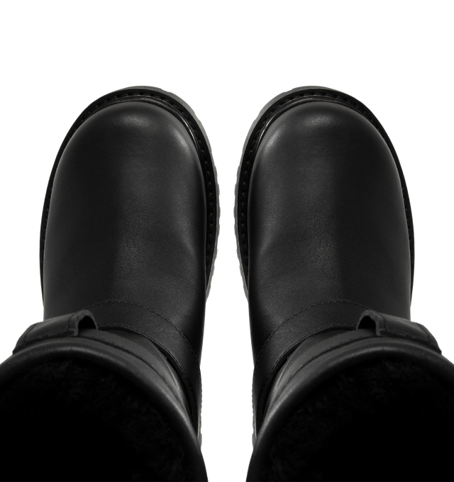 Image 4 of 4 - BLACK - UGG x Willy Chavarria Biker Boot is crafted from leather and reimagines UGG's iconic silhouette with a rugged, moto-inspired design. Featuring a mid-calf profile, chrome hardware detailing, and UGG's signature plush sheepskin lining, the boot combines bold utility styling with exceptional comfort. Main Material: Leather. Lining: Sheepskin. Unisex style in men's sizes. 