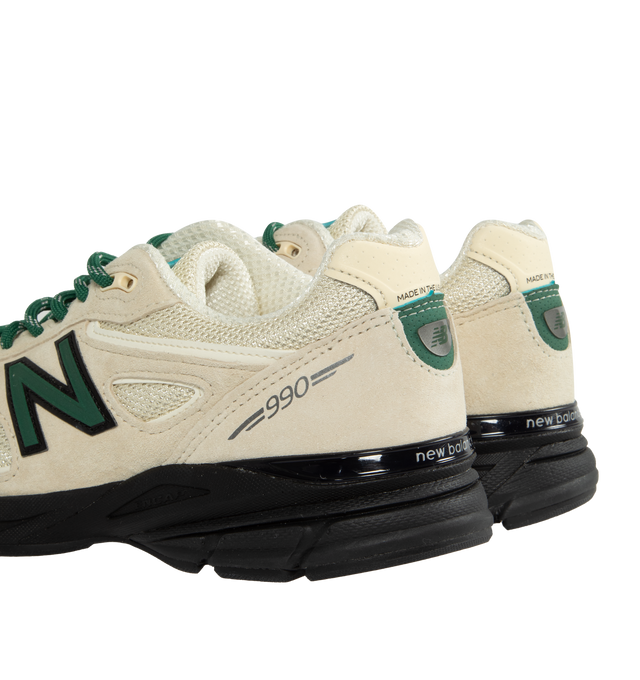 Image 3 of 5 - WHITE - NEW BALANCE 990 sneaker in "Macadamia Nut" colorway crafted from premium materials, light beige mesh uppers, cream suede, accented with pops of green and black throughout. The signature 990 branding marks the heels and sidewalls, while the iconic ENCAP midsole and foam cushioning provide unparalleled comfort underfoot. Featuring mesh uppers, suede overlays, rubber outsole. Made in the USA. 