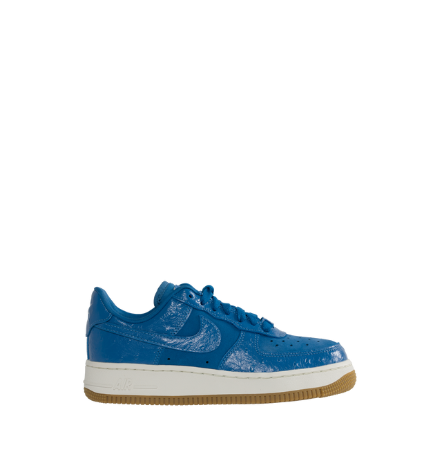 Image 1 of 5 - BLUE - NIKE Air Force 1 snaker crafted from premium leather and textiles, with a foam midsole and rubber sole. Featuring Star Blue ostrich-textured leather upper, Metallic Gold graphics,  padded collar,  gum outsole with Nike Air cushioning for lightweight, all-day comfort. 