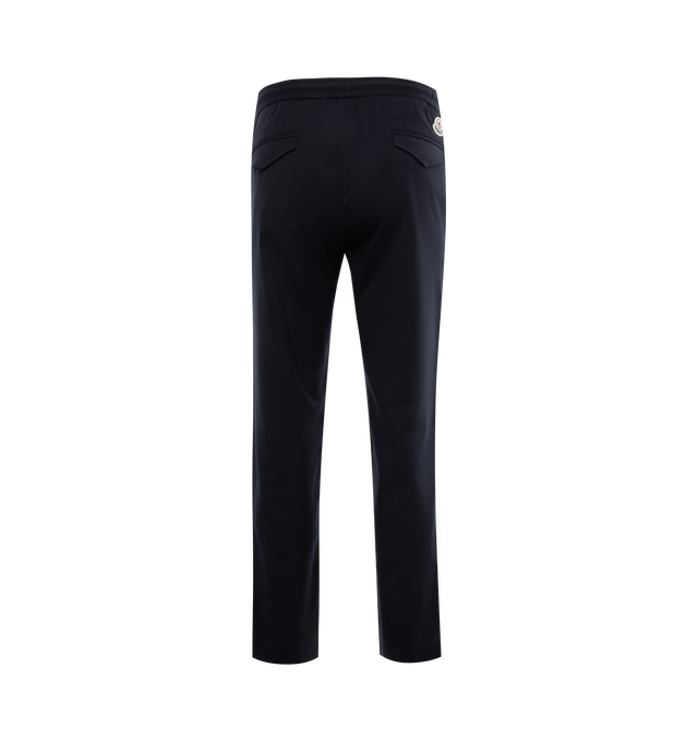 Image 2 of 3 - NAVY - MONCLER Jogging Pants featuring gabardine and wool blend, waistband with drawstring fastening, zipper closure, side slant pockets, back pockets with snap button closure, side striped bands with embroidered logo lettering and logo patch. 54% virgin wool, 45% polyester, 1% elastane/spandex. 