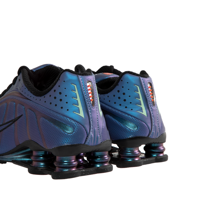 Image 3 of 5 - PURPLE - Nike Shox R4 featuring iridescent upper that shifts between shades of purple and blue. Featuring perforated detailing,  signature Shox pillars in the heel for enhanced impact protection, black accents on the laces and midsole. 