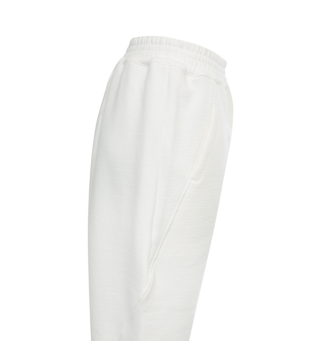 Image 3 of 3 - WHITE - THE ROW Koa Pant featuring low-waist, heavy French terry with tapered leg, elasticated waistband and washed finish for a worn-in feel. 97% cotton, 3% elastane. Made in Italy. 