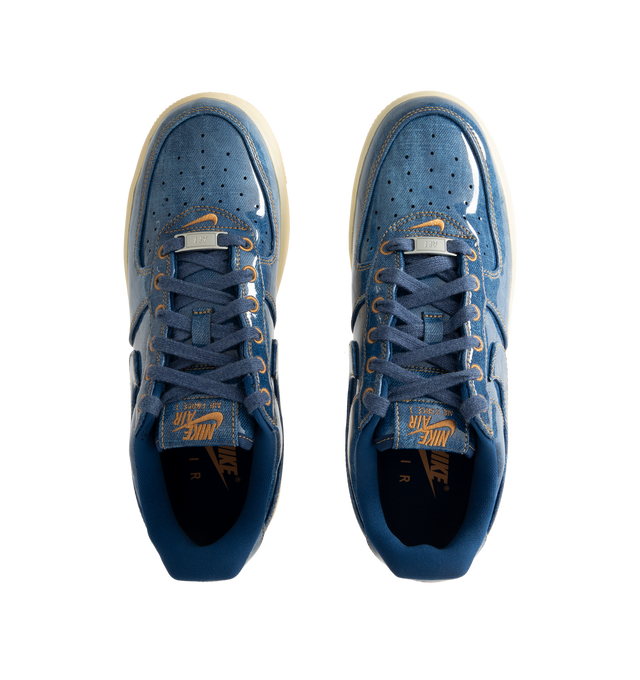 Image 5 of 5 - BLUE - Nike Men's Air Force 1 Low Retro Premium Sneaker featuring patent leather denim upper with perforated toe box, Nike Air technology and rubber outsole with heritage hoops pivot circles. 