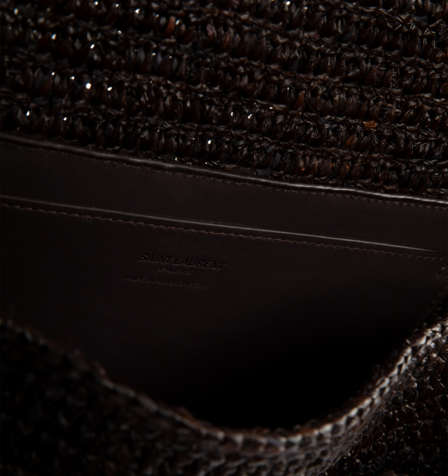 Image 4 of 4 - BROWN - SAINT LAURENT Niki Medium Raffia Bag featuring multiple pockets, sliding leather-and-chain shoulder strap, bronze-tone hardware, magnetic snap closure, one open pocket, one zip pocket and one pocket under flap. 11" x 7.8" x 3.3". Raffia/calfskin. Made in Madagascar. 