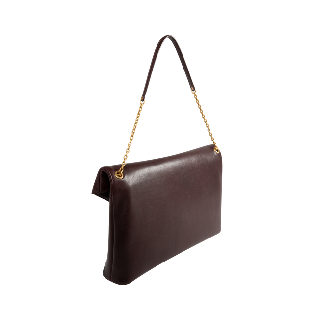 Image 2 of 3 - BROWN - SAINT LAURENT XXL Envelope Pouch featuring extra-large chain pouch decorated with the cassandre on front, a stowable cable-chain strap, leather lining, bronze-tone hardware, snap-button closure and one zip pocket. 13.8" x 8.7" x 0.81.7". Strap drop: 11". Calfskin. Made in Italy. 