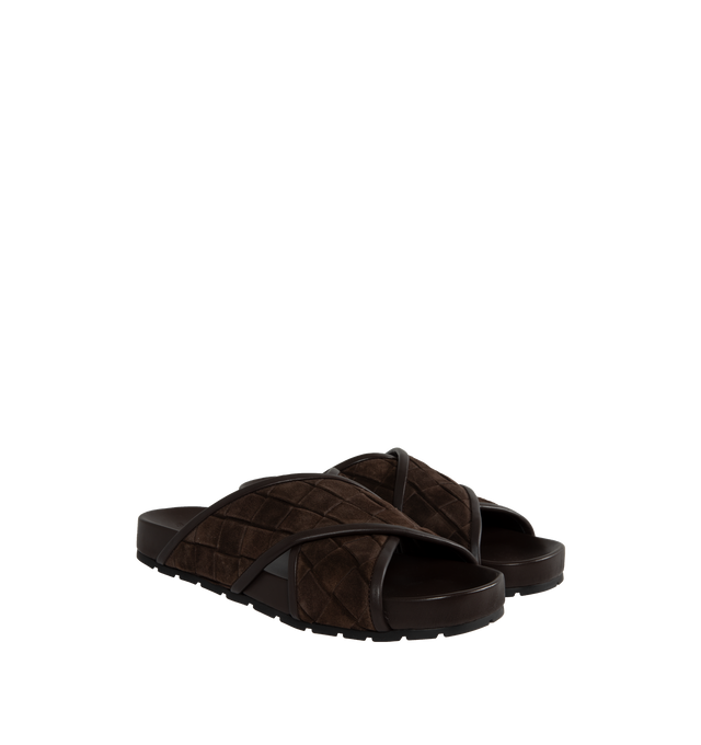 Image 2 of 4 - BLACK - BOTTEGA VENETA Tarik Intrecciato Suede Slide Sandals featuring signature woven intreccio suede with leather piping, flat heel, open toe, crisscross vamp, easy slide style and molded comfort footbed. Made in Italy. 