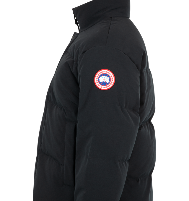 Image 3 of 4 - BLACK - CANADA GOOSE Bayview Parka Black Label featuring placket with snap buttons over two-way zipper, recessed rib-knit cuffs, brushed tricot-lined chin guard, hem with interior drawcord, interior backpack straps for hands-free carrying capabilities, two exterior fleece-lined pockets with snap closures, two interior mesh drop-in pockets and one zippered security pocket. 85% recycled polyester, 15% organic cotton. 