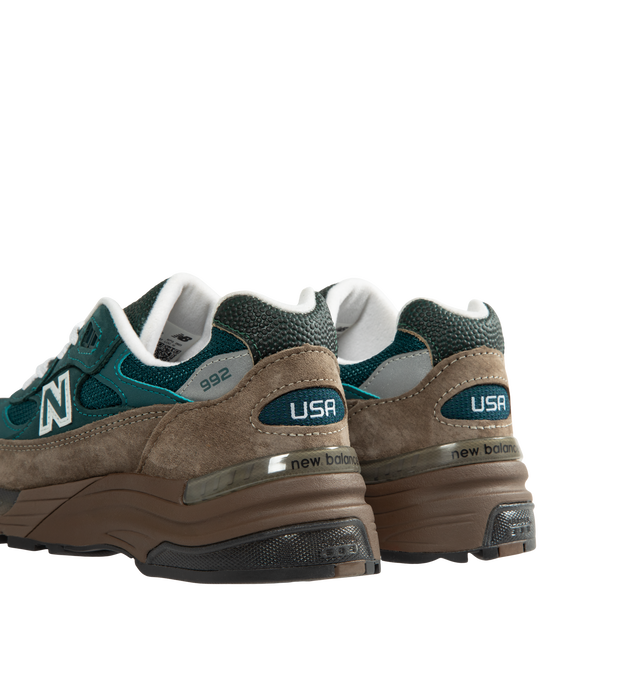 Image 3 of 5 - GREEN - New Balance Made in USA 992 Sneakers feature a timeless silhouette that blends premium craftsmanship with advanced comfort technology. A fan-favorite since its introduction, this seasonal edition showcases a tonal blue upper crafted from breathable mesh and premium suede overlays, contrasted by a black sole unit. ABZORB cushioning at the heel and forefoot provides exceptional impact absorption, while the ENCAP and C-CAP midsole combination delivers lightweight support and stability. F 