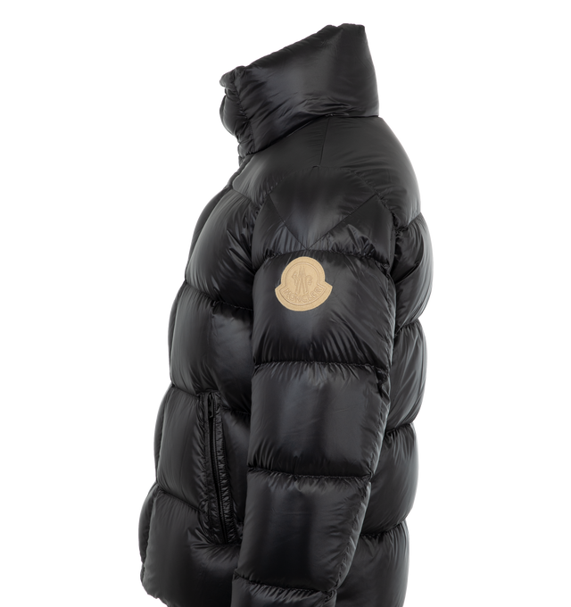 Image 3 of 3 - BLACK - Moncler Dervox Puffer Jacket has a stand collar, zipper and snap button closure, zipper pockets, adjustable shoulder straps, elastic hem and cuffs, and felt logo patch. Down filled. 100% polyamide. Made in Moldova.  