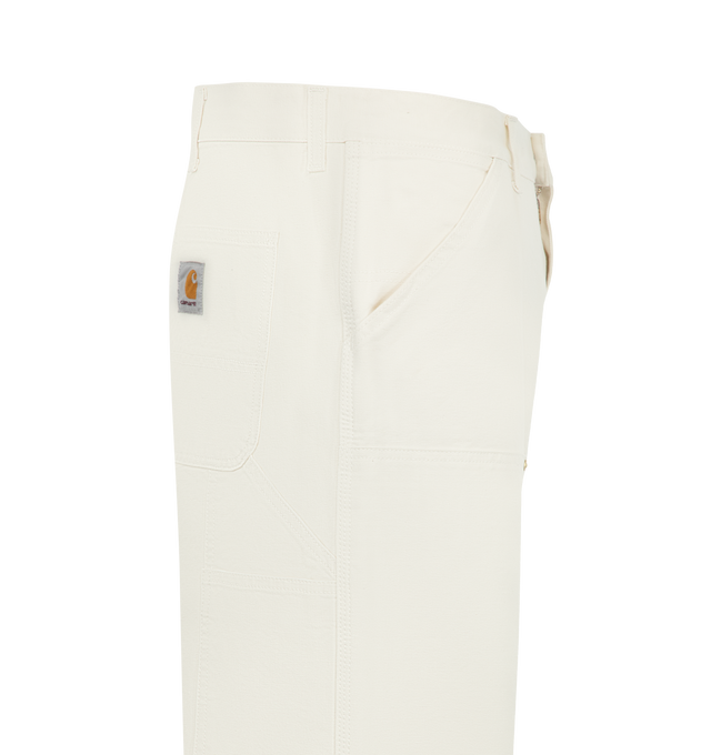 Image 3 of 3 - NEUTRAL - Carhartt WIP Double Knee Carpenter Pants are crafted in a heavyweight canvas material in a loose straight fit. Featuring a double-layer knees, zip fly with button closure, front slant pockets, tool pocket, back patch pockets and hammer loop. Material: 100% Organic Cotton 'Dearborn' Canvas, 12 oz. Made in Tunisia. 