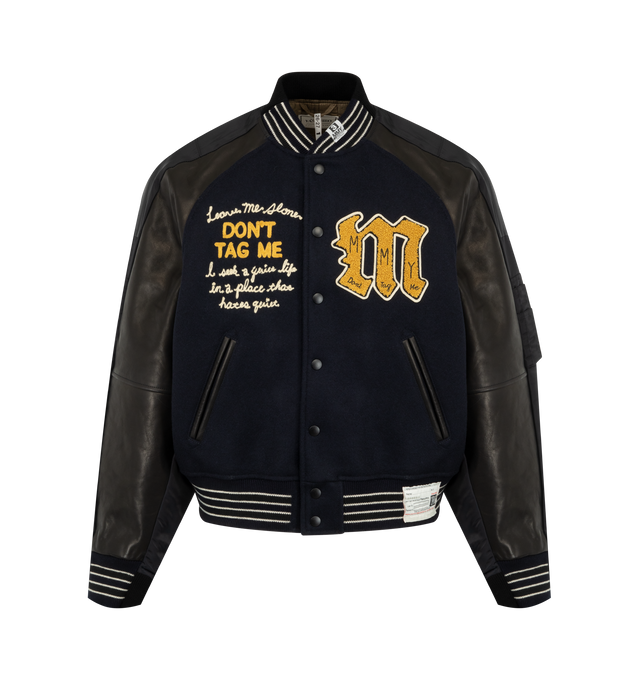 Image 1 of 3 - BLACK - Maison Mihara Yasuhiro Men's Combined Stadium  Bomber Jacket is crafted from a premium mixed-material construction and features a hybrid stadium and bomber silhouette with ribbed trim, a front button closure, and side pockets for a contemporary layered look. This designer jacket combines classic varsity-inspired elements with Maison Mihara Yasuhiro's signature deconstructed aesthetic, creating a bold statement piece for everyday wear. Main Material: Mixed Materials. Made in Japan. 