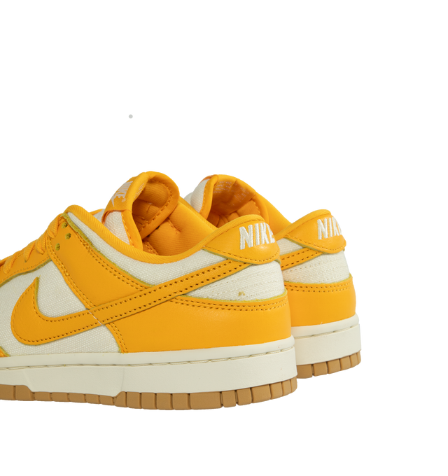 Image 3 of 5 - YELLOW - NIKE Dunk Low Retro Basketball Sneaker featuring lace-up style, removable insole, leather and textile upper, synthetic lining and rubber sole.  