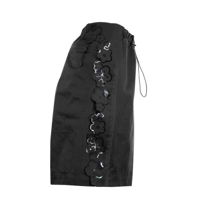 Image 3 of 3 - BLACK - TNF X CB Ellie Mountain Shorts featuring water-repellent fabric, streamlined silhouette, full-length side zippers, glossy floral appliqus trace the seams, cinched elastic waistband with a delicate flower cord lock, seam-taped finishes and a back zip pocket. 100% nylon. 