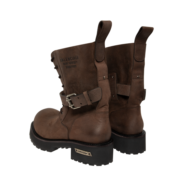 Image 3 of 4 - BROWN - Balenciaga Mens Venom Lace-Up Booties are crafted from grained calfskin leather. Feature a lace-up design, extra round toe, adjustable buckle strap, worn-in finish, debossed logo at the upper, engraved logo plate at the outsole, back pull loop, and thick toothed rubber sole. Main Material: Upper: Calfskin Leather; Sole: TPU; Insole: Calfskin Leather. Made in Italy. 
