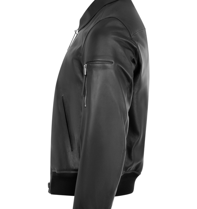 Image 3 of 3 - BLACK - TOM FORD Soft Nappa Plonge Collar Blouson Jacket featuring grained lambskin jacket, spread collar, two-way zip closure, welt pockets and embossed logo at waist, rib-knit hem and cuffs, utility pocket at sleeve, welt pocket at interior, cotton-blend twill lining and logo-engraved silver-tone hardware. 100% lambskin. Body lining: 56% cotton, 44% viscose. Sleeve lining: 61% cupro, 39% viscose. Made in Italy. 