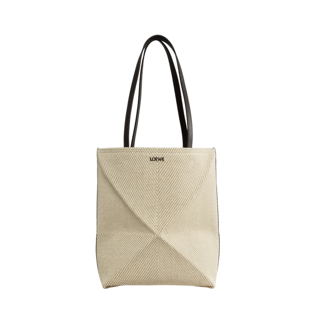Image 1 of 4 - NEUTRAL - LOEWE PAULA'S IBIZA Puzzle Fold Tote Bag with LOEWE's signature geometric lines reimagined in graphic and architectural panels that allow the bag to fold completely flat, making it the perfect travel companion. Soft, lightweight and inventively crafted, it features calfskin handles and is finished with gold metal LOEWE branding. This medium version is made in Spain using raffia palm that is cultivated, harvested, sun-dried and woven in Madagascar by local artisans.?Loewe Paula's Ibi 