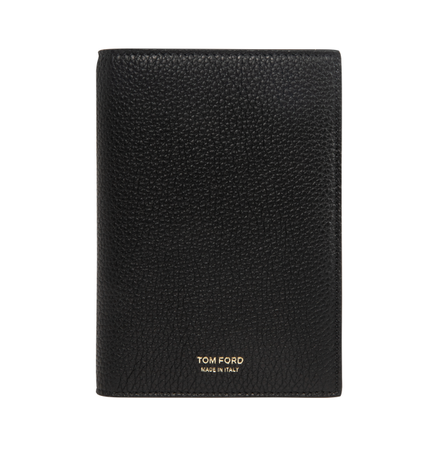 Image 1 of 3 - BLACK - TOM FORD Soft Grain Leather T Line Passport Holder featuring pebble-grained calfskin passport holder, gold-tone logo stamp at face, six card slots at interior, two passport slots and canvas lining. H5.75" x W4" x D1". Calfskin. Made in Italy. 