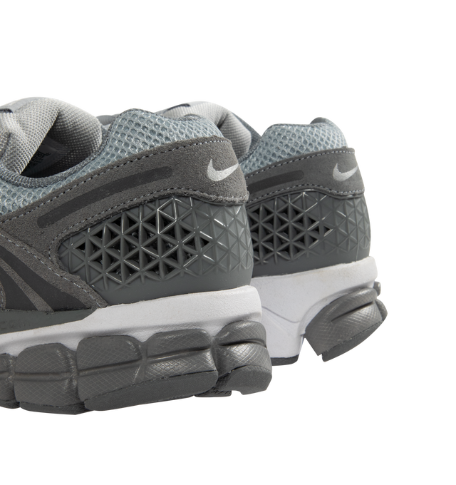 Image 3 of 5 - GREY - NIKE Zoom Vomero 5 Sneaker featuring upper with real and synthetic leather for a layered, mesh panels and ventilation ports on the heel, Zoom Air cushioning, plastic caging on the side, rubber outsole and reflective details. 