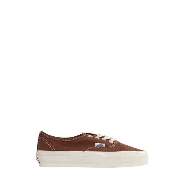 Image 1 of 5 - BROWN - VANS Authentic Reissue 44 LX Sneakers featuring low-top, lightweight canvas upper,  lace-up closure, logo flag at outer side, rubber logo patch at heel, textured rubber midsole, treaded rubber sole and contrast stitching in white. Upper: canvas. Sole: rubber.  