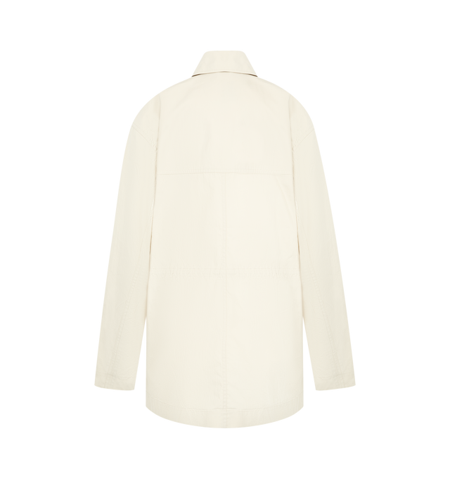 Image 2 of 3 - WHITE - TOTEME Collared Drawstring Jacket featuring utility jacket with an oversized fit, rounded, dropped shoulders, unlined cotton twill, front flap pockets, a concealed placket with top button visible and internal drawstring. 60% organic cotton, 40% recycled polyamide. 