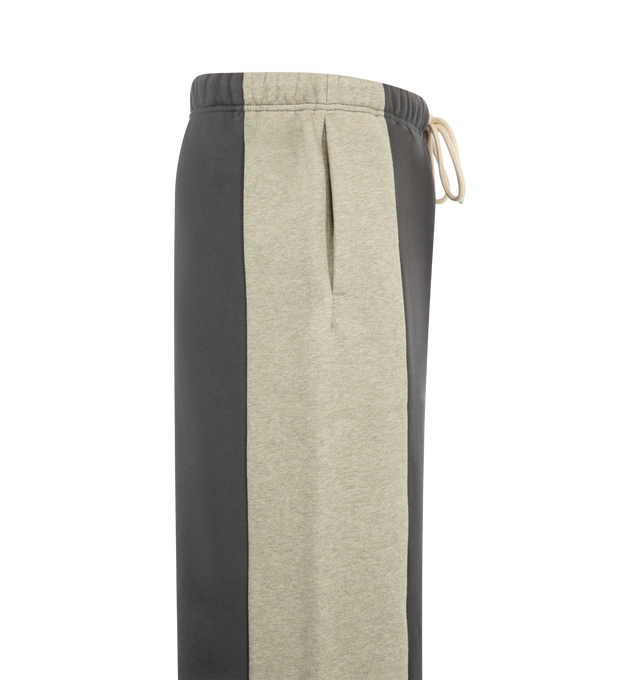 Image 3 of 3 - GREY - Fear of God Essentials Mens Lounge Pants are crafted from heavyweight 380 GSM cotton-blend core fleece. Feature a wide-leg fit, paneled construction, elasticized waistband with bungee drawcord, side-seam pockets, and an Essentials logo label. Main Material: 80% Cotton, 20% Polyester. 