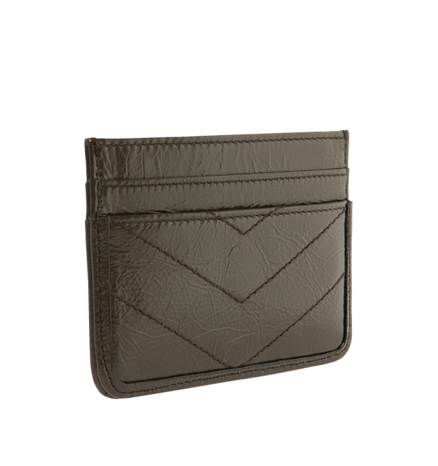 Image 2 of 3 - BROWN - Saint Laurent Womens Card Case is crafted from glossy naplak leather. Features signature CASSANDRE hardware, matelass quilted stitching, four card slots, and one center slip pocket. Dimensions: 9.9  7.6  0.5 cm. Main Material: Leather. Made in Italy. 