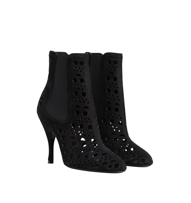 Image 1 of 1 - BLACK - Alaa Women's Heeled Chelsea boots crafted from soft suede leather and detailed with the house's signature Vienne motif in intricate geometric cutouts. The design features a round toe, elasticated side panels, and slender 100mm stiletto heels that create a sleek, elongated silhouette. Heel height: approximately 100mm / 4 inches. Material: leather (suede). Sole: leather insole and sole. Closure: elasticated sides. Made in Italy. 